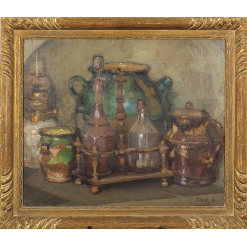 1046 - Still life items on a table, vessels, oil on canvas, bearing an indistinct signature possibly Fran T... 