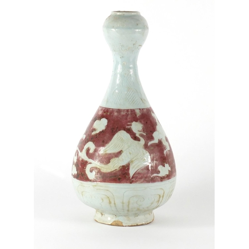 434 - Chinese garlic neck stoneware vase, incised with phoenixes amongst clouds, 31cm high