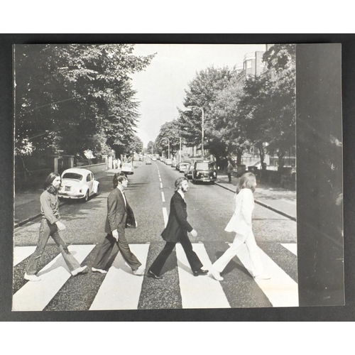 189 - Four Beatles black and white proof photographs, relating to the Abbey Road vinyl cover, each 25.5cm ... 