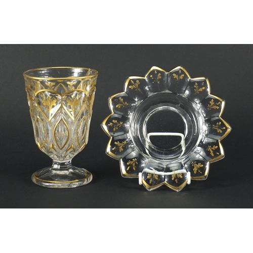 587 - 19th century Ottoman Beykoz glass goblet on stand, gilded with flowers, overall 15cm high