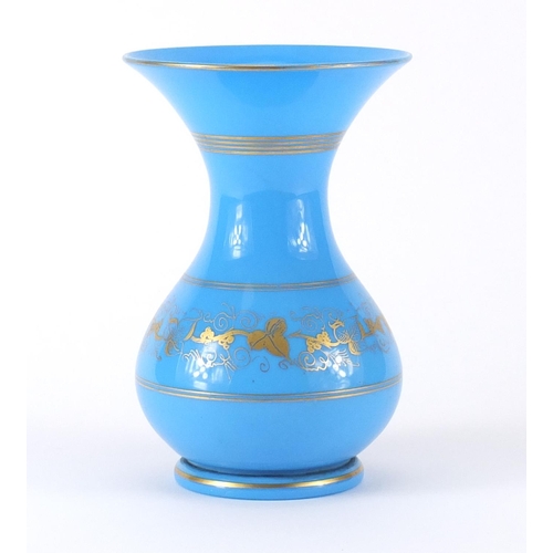 666 - French Napoleon III blue opaline glass vase, gilded with a band of foliage, 19cm high