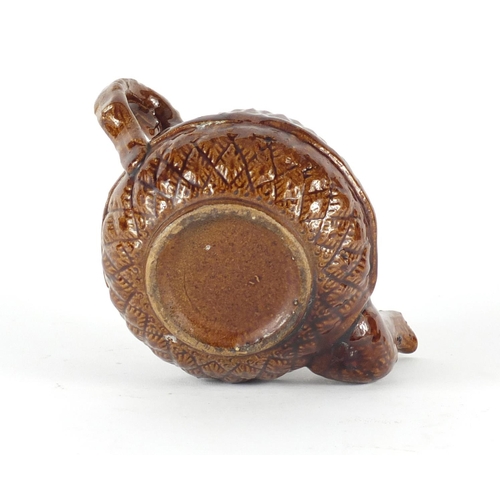 616 - 19th century treacle glazed pottery teapot with corn design , 11cm high