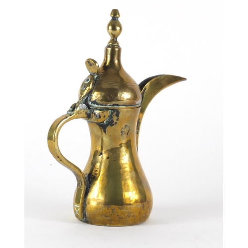 576 - Islamic brass coffee pot, the side with impressed inscription, 25cm high