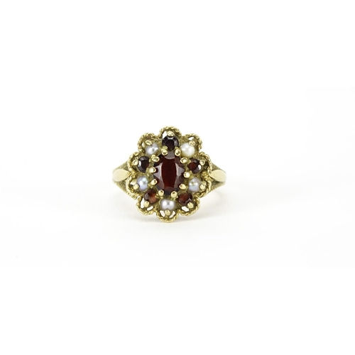 879 - 9ct gold garnet and seed pearl cluster ring, size M, 4.0g
