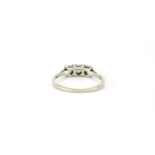 852 - Platinum and diamond three stone ring, size Q, 3.5g