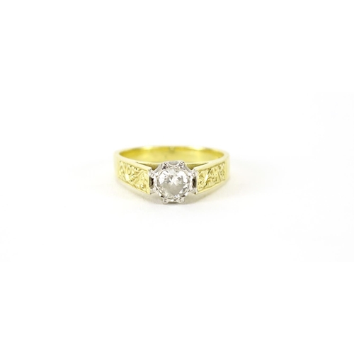 863 - 18ct gold diamond solitaire ring, the shoulders engraved with flowers, size O, 5.5g