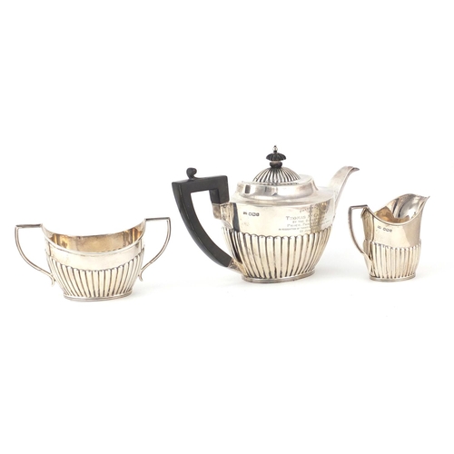760 - Silver demi fluted three piece tea service by Mappin & Web, Sheffield 1919, the teapot 25cm wide, 67... 