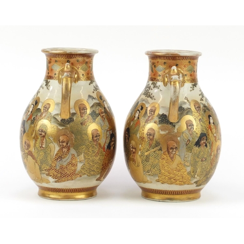 449 - Pair of Japanese Satsuma pottery vases with twin handles, each hand painted with sages, character ma... 