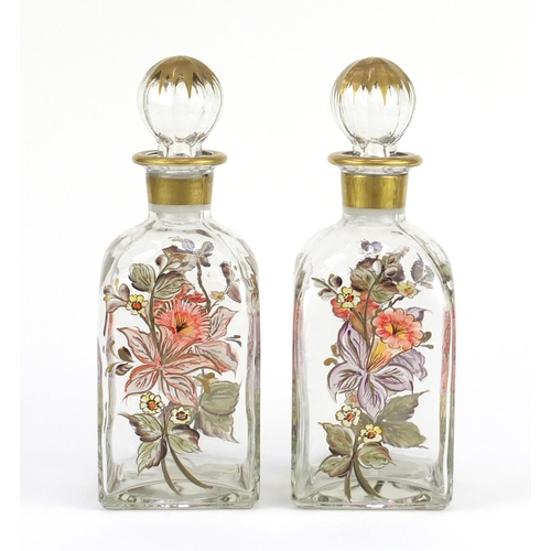 665 - Pair of continental glass decanters, hand painted with flowers