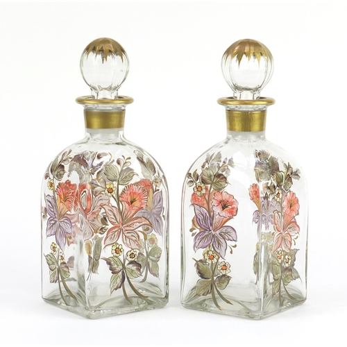 665 - Pair of continental glass decanters, hand painted with flowers
