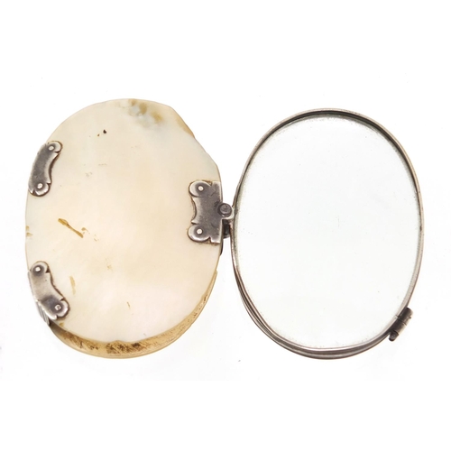 94 - Victorian silver mounted mother of pearl folding magnifying glass, 7cm wide