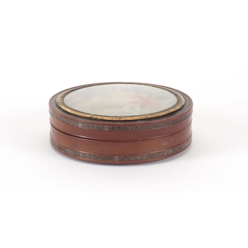 55 - 18th century circular lacquer snuff box with gold coloured mounts, metal studwork and tortoiseshell ... 