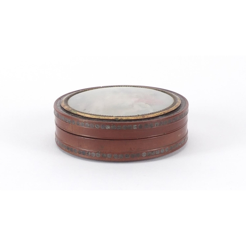 55 - 18th century circular lacquer snuff box with gold coloured mounts, metal studwork and tortoiseshell ... 