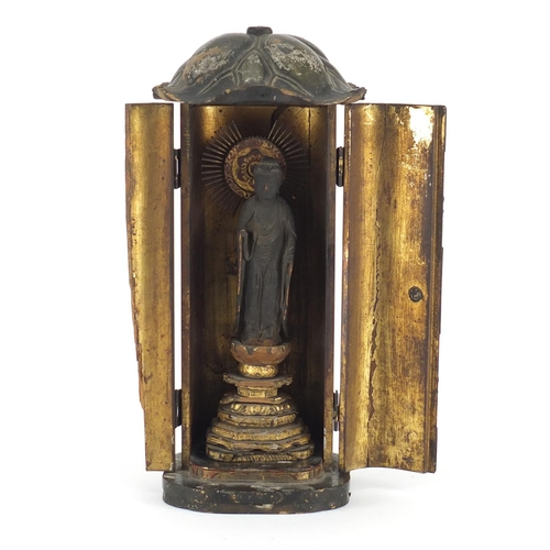 473A - Japanese travel shrine, housed in a lacquered case with gilt interior, the case 29cm high