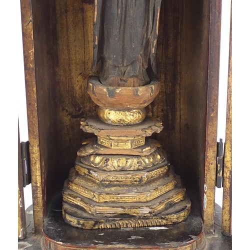 473A - Japanese travel shrine, housed in a lacquered case with gilt interior, the case 29cm high