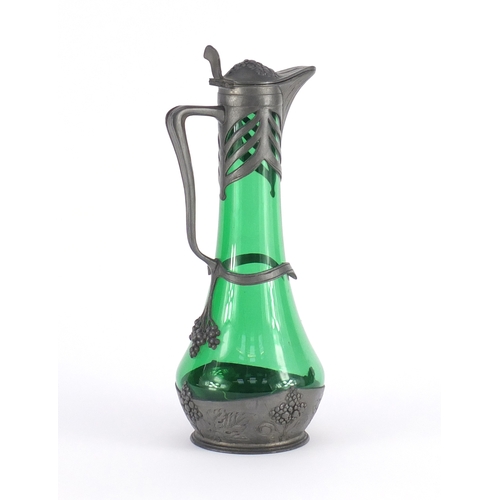 723 - Art Nouveau pewter and green glass claret jug by Osiris, embossed with grapes on vines, impressed Os... 