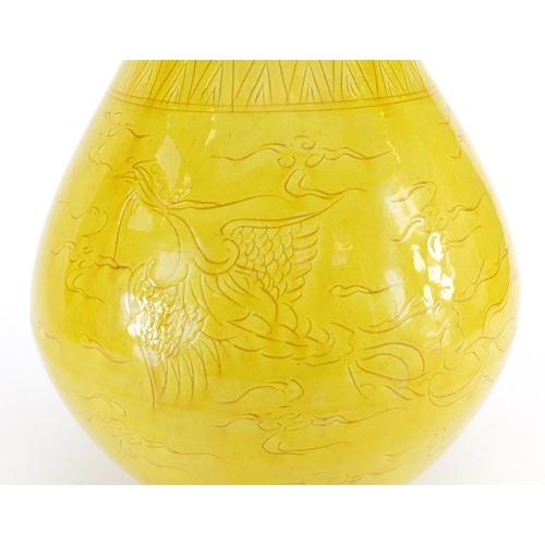 425 - Chinese yellow glazed porcelain vase with mythical head handles, incised with a dragon and phoenix a... 