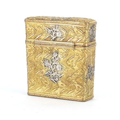 95 - Antique gilt metal necessaire with applied silver floral decoration, the hinged lid opening to revea... 