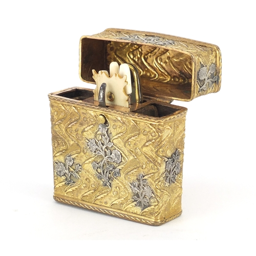 95 - Antique gilt metal necessaire with applied silver floral decoration, the hinged lid opening to revea... 