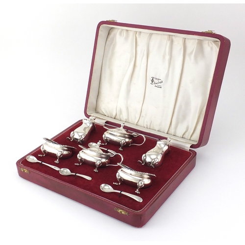 751 - Silver six piece cruet with blue glass liners, hallmarked Birmingham 1968, housed in a velvet and si... 