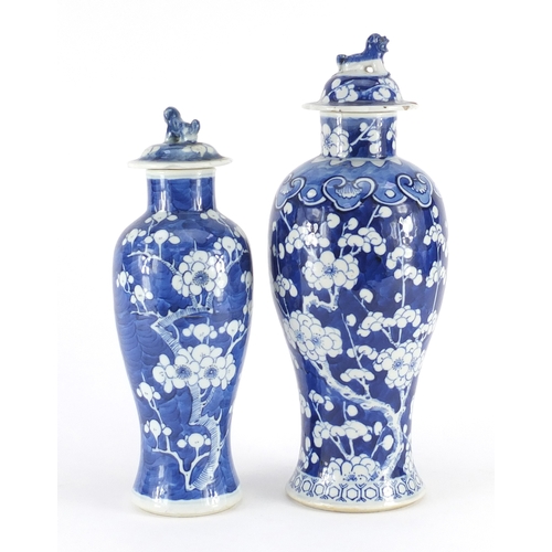 353 - Two Chinese blue and white porcelain baluster vases and covers, hand painted with prunus flowers, on... 