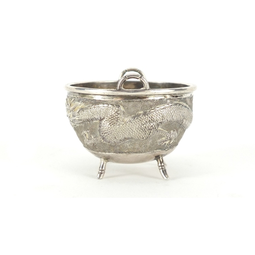 477 - Chinese silver four footed bowl with handles by Tuck Chang & Co, embossed with a dragon, impressed m... 