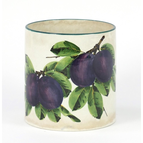 626 - Wemyss Ware cylindrical pot, hand painted with plums, painted and impressed marks to the base, 12cm ... 