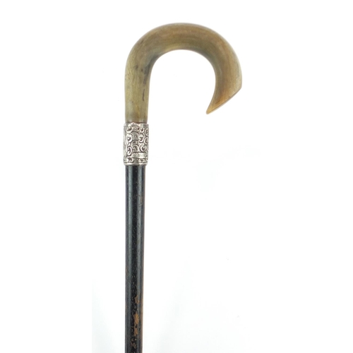 75 - Horn handled walking stick with silver collar and ebonised shaft, probably rhinoceros horn, 81.5cm i... 