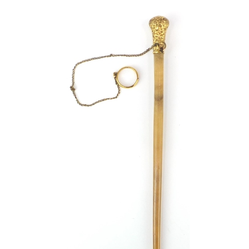 71 - Victorian gilt metal mounted rhinoceros horn swagger stick, 96cm in length, 53.4g