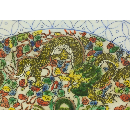381 - Chinese porcelain charger hand painted in the famille verte palette with dragons amongst clouds, six... 