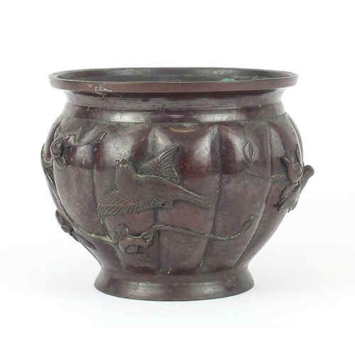 463 - Japanese patinated bronze fluted jardinière, cast with birds of paradise amongst trees, 16cm high