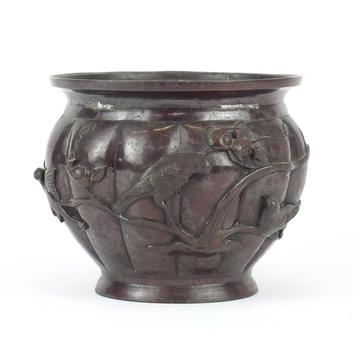 463 - Japanese patinated bronze fluted jardinière, cast with birds of paradise amongst trees, 16cm high