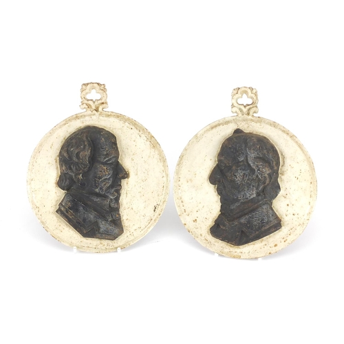 97 - Pair of 19th century cast iron portrait plaques comprising William Gladstone and Benjamin Dizrali, e... 