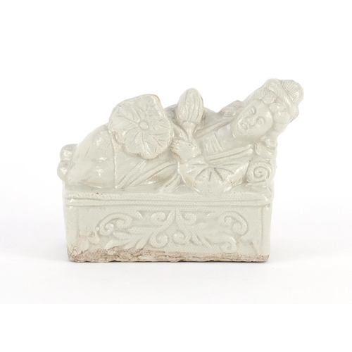 431 - Chinese white glazed stoneware brush rest in the form of a reclining female, 10.5cm wide