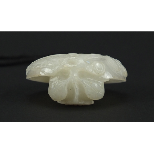 490 - Chinese white jade belt hook, finely carved with flowers, 6cm high