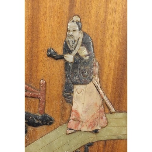 497 - Pair of Chinese hardwood and soapstone panels, each depicting figures, each with Yai Loong labels ve... 