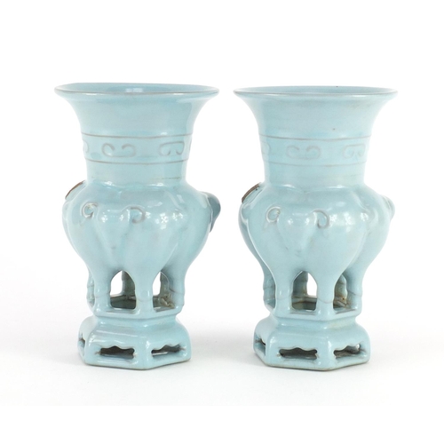 418 - Pair of Chinese porcelain archaic style vases on stands, with elephant heads, both with character ma... 