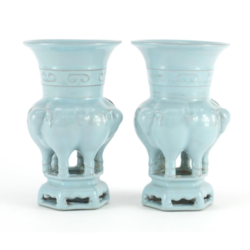 418 - Pair of Chinese porcelain archaic style vases on stands, with elephant heads, both with character ma... 