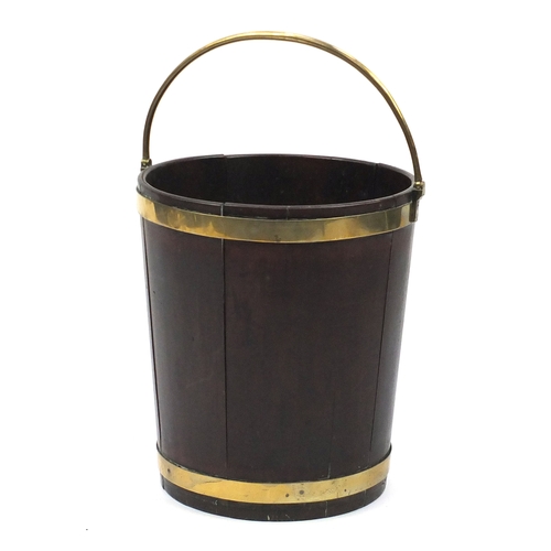 128 - 18th century Irish brass bound mahogany peat bucket, with brass swing handle 46cm high excluding the... 