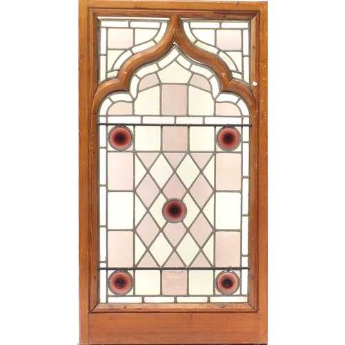 35 - * Description amended 12-09-19*Pair of pitch pine framed leaded stained glass panels, framed, each 1... 