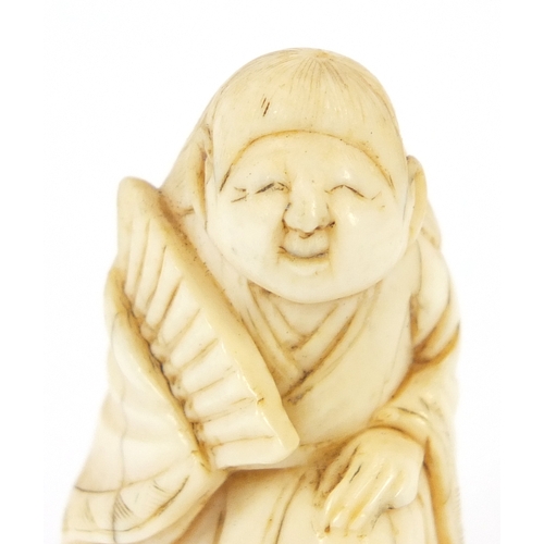 483 - Japanese carved ivory netsuke of a figure in a robe, 4.5cm high