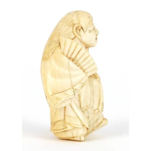 483 - Japanese carved ivory netsuke of a figure in a robe, 4.5cm high