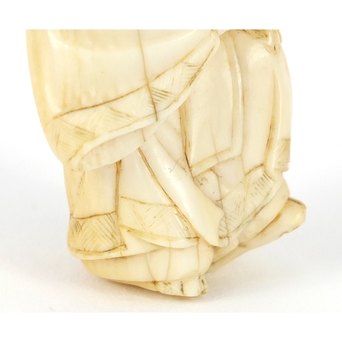 483 - Japanese carved ivory netsuke of a figure in a robe, 4.5cm high