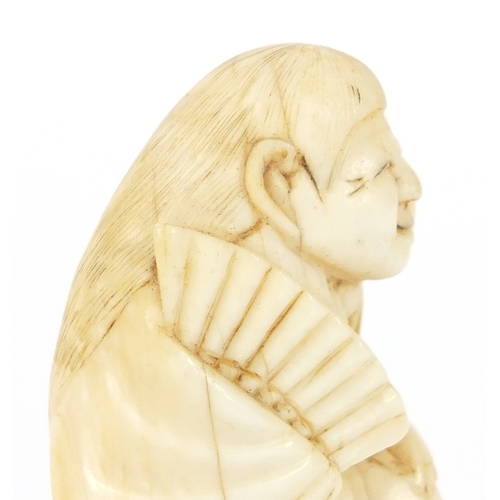 483 - Japanese carved ivory netsuke of a figure in a robe, 4.5cm high