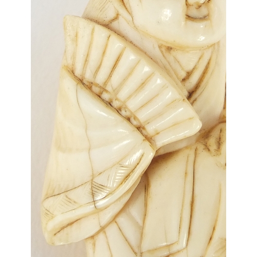 483 - Japanese carved ivory netsuke of a figure in a robe, 4.5cm high