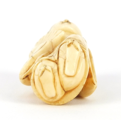 483 - Japanese carved ivory netsuke of a figure in a robe, 4.5cm high