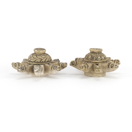 529 - Pair of Islamic stone oil lamps carved with lion heads, each 10cm high x 17cm in diameter