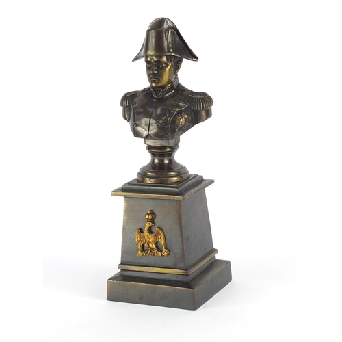 27 - Patinated bronze bust of Napoleon Bonaparte, raised on a square tapering base, overall 26cm high