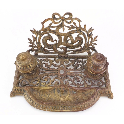 33 - 19th century gilt brass serpent and eagle design desk stand with a pair of inkwells, 34cm wide