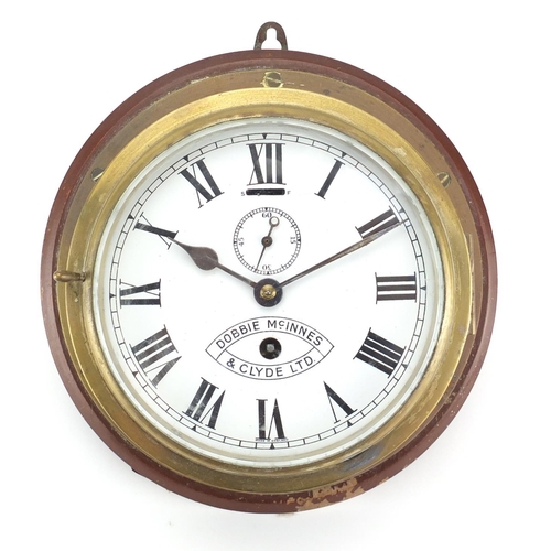 2117 - Brass ships bulk head clock, the enamelled dial with Roman numerals inscribed Dobbie Mcinnes and Cly... 